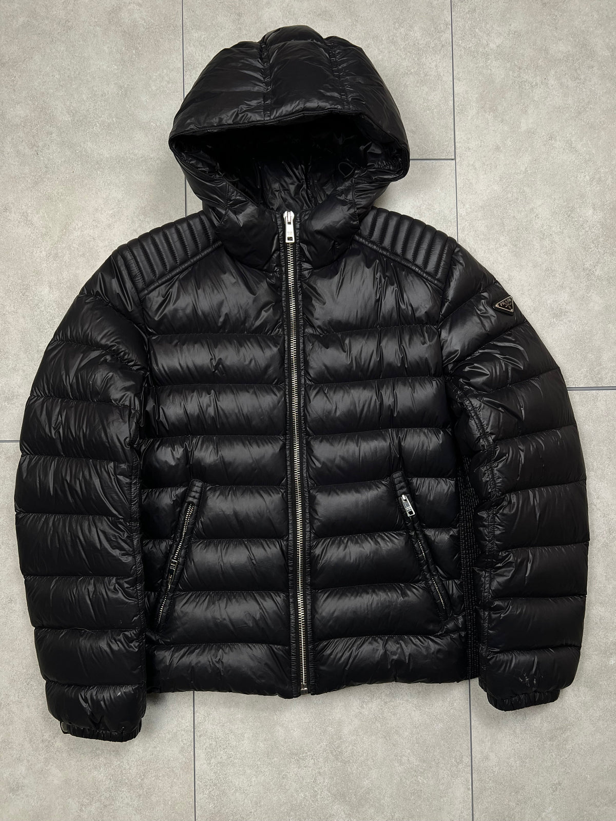 Prada puffer jacket, size 50 (fits L), pre-owned 8/10 condition (small holes on one sleeve, shown in photos) – Relique