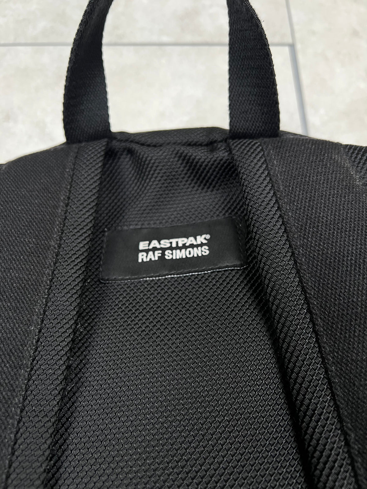 Raf Simons x Eastpak backpack, large size, pre-owned 10/10 condition – Relique