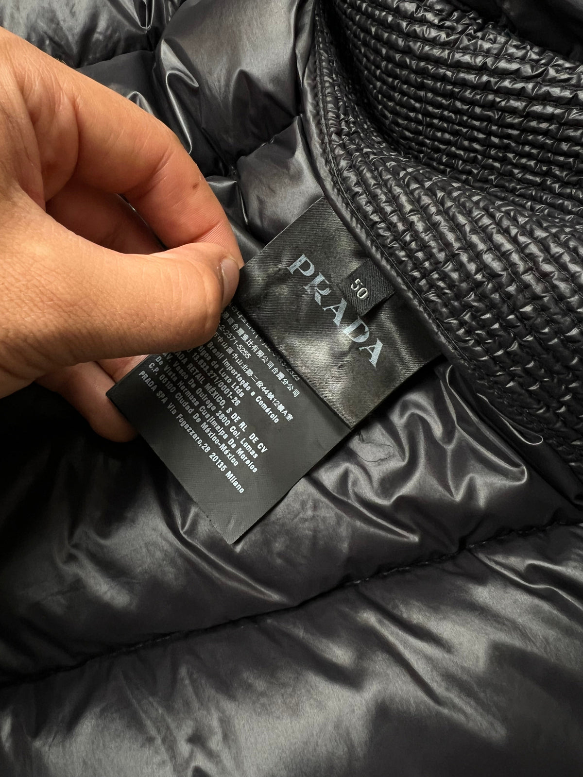 Prada puffer jacket, size 50 (fits L), pre-owned 8/10 condition (small holes on one sleeve, shown in photos) – Relique