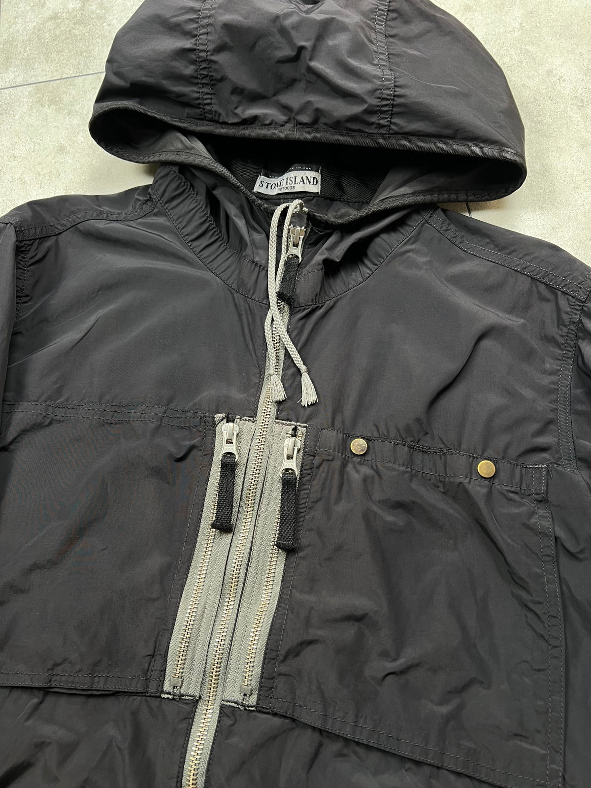 Stone Island jacket, size M, pre-owned 7/10 condition (small rips/holes shown in photos) – Relique