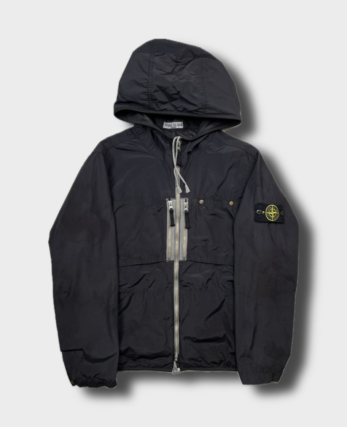 Stone Island jacket, size M, pre-owned 7/10 condition (small rips/holes shown in photos) – Relique
