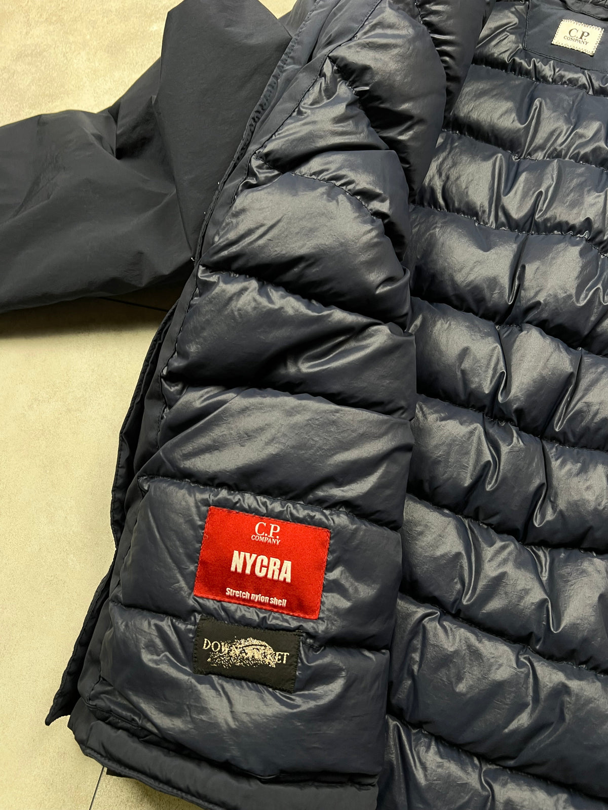 C.P. Company puffer jacket, size L, pre-owned 8/10 condition – Relique